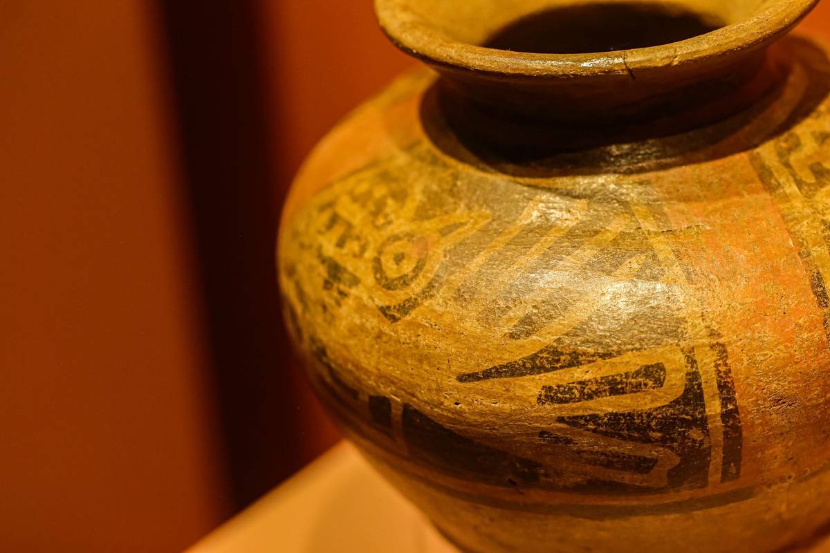 Close-up of an ancient pottery piece showcasing intricate decorative patterns.